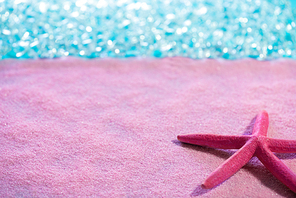 Starfish in pink sand beach and tropical sea aqua turquoise water