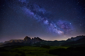 Milky Way over Alpe di Siusi (also known as Seiser Alm) in Dolomites mountain, Sudtirol, Italy
