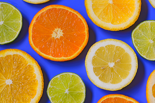 Blue background with citrus fruit slices