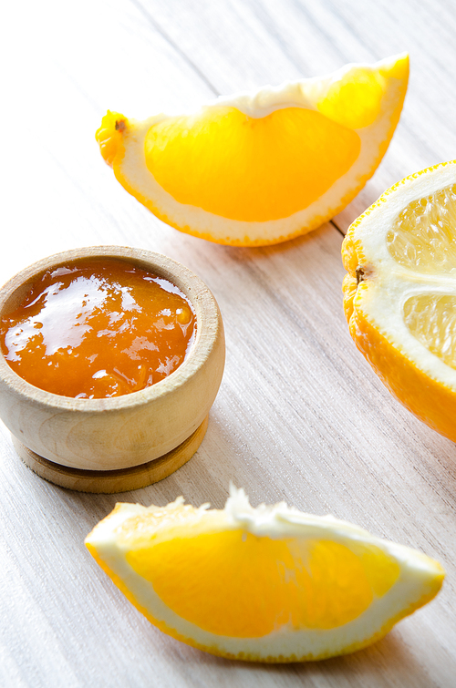 Orange jam served in spoon on the table