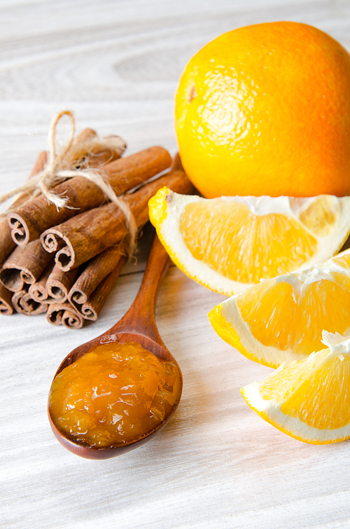 Orange jam served in spoon on the table