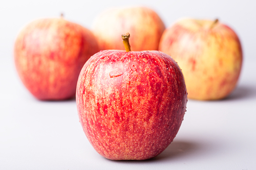 apples on a white wooden background, studio picture