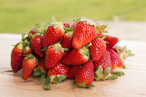 strawberries on garden's table, outdoor picture