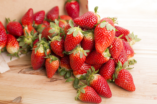 strawberries on a wooden table, studio picture