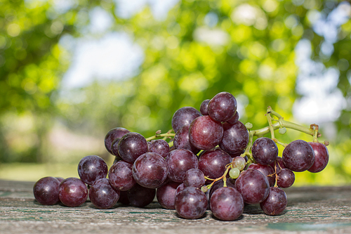 grapes in wooden table, outdoor