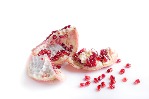 ripe cuting pomegranate  around white background