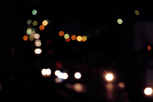 Defocused traffic lights in vintage color, nightlife background