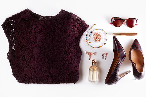 Fashion flat lay scene. Dress, hight heel shoes and sunglasses, dressing up for party fashion accessoires