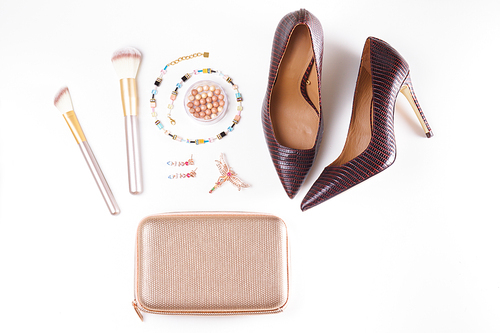 Fashion flat lay scene. Hight heel shoes, bag, dressing up for party fashion accessoires.