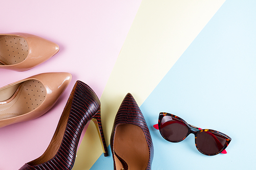Elegant high heel shoes and sunglasses, flat lay style scene
