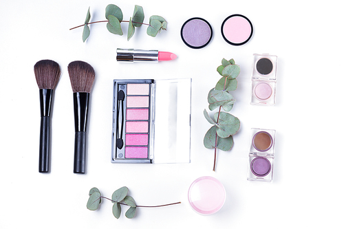 Professional makeup tools with beauty products, flat lay on white background