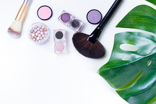 Professional makeup tools with cosmetic beauty products close up, flatlay on white background
