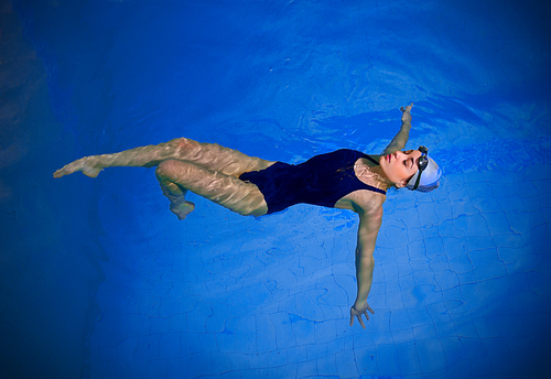 Young woman swimmer in pool