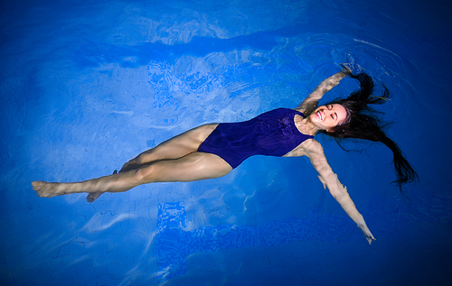 Young woman swimmer in pool