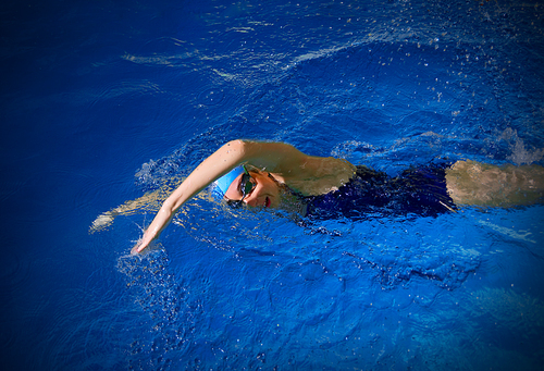 Young woman swimmer in pool