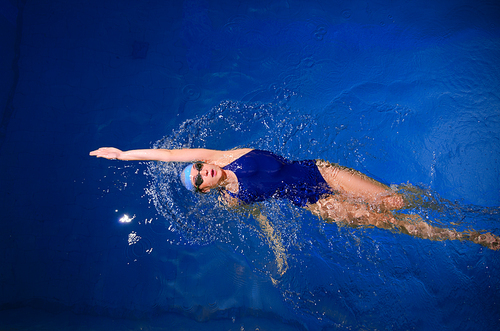 Young woman swimmer in swimming pool