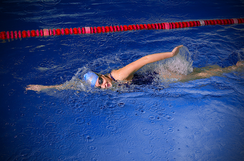 Young woman swimmer in swimming pool