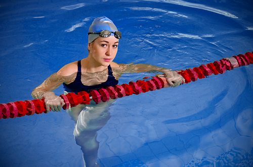 Young woman swimmer in swimming pool