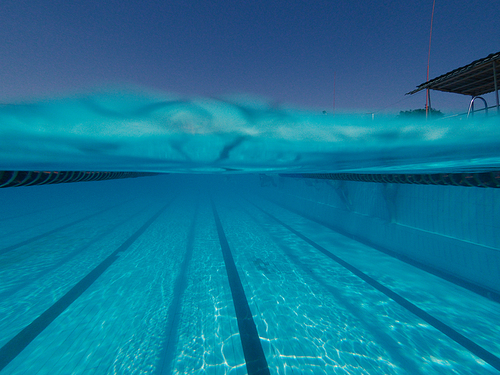 Split Image Swimming pool underwater and over water surface