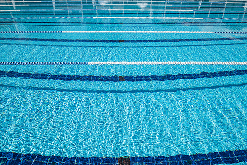 Olympic Swimming pool background on a bright Sunny day