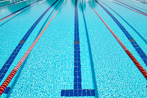 Olympic Swimming pool background on a bright Sunny day