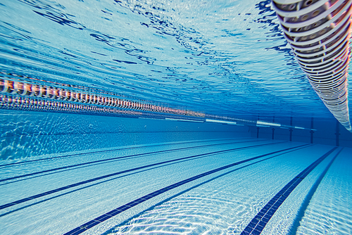 Olympic Swimming pool underwater background.