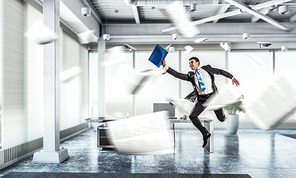 Funny jumping businessman in modern 3D rendering interior. Mixed media