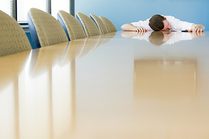 Man sleeping on conference table