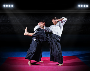 Two aikido fighters at sports hall