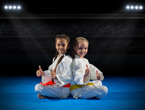 Girls martial arts fighter in sports hall