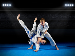 Boys martial arts fighters at sports hall