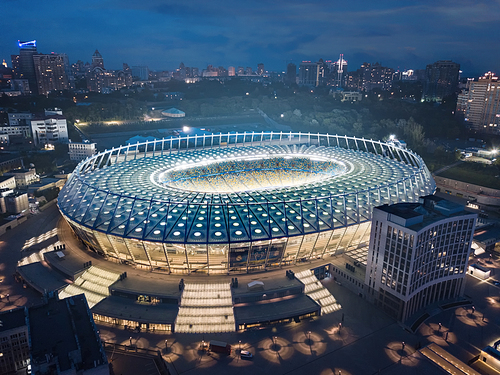 Kiev, Ukraine - May 21: Aerial night view of Football stadium Olimpiyskiy National Sports Complex. In white Grand Stadium passed the 2018 UEFA Champions League Final.