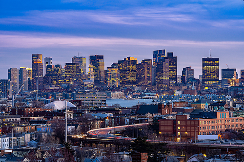 Boston Cityscape with highway trail to Boston MA USA at night.