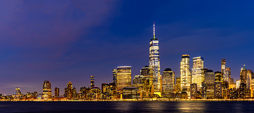 New York city Lower Manhattan skyline cityscape at dusk from New Jersey.