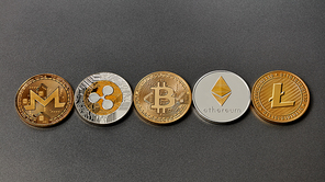 Set of gold and silver coins monero, ripple, bitcoin, litecoin, ethereum, dash on a black background. Conceptual image for worldwide cryptocurrency and digital payment system. Top view