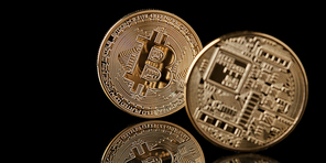 Bitcoin gold coin from both sides isolated on black background, New Virtual money concept, can be used for video cover or site