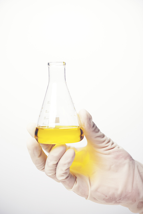 Chemical liquid in glassware of science lab on white background