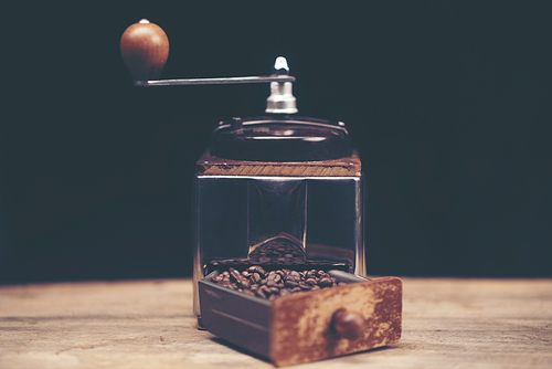 Close up of coffee brewing gadgets on wooden bar counter.