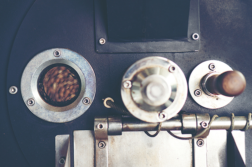 fresh coffee beans in roast machine, arabica roasted coffee ,vintage filter image