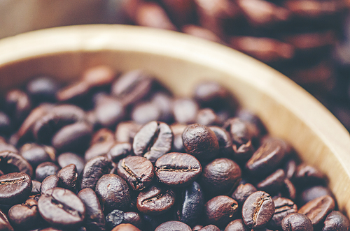 coffee beans on wooden background, arabica coffee, vintage filter image