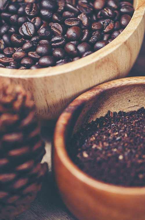 coffee beans on wooden background, arabica coffee, vintage filter image