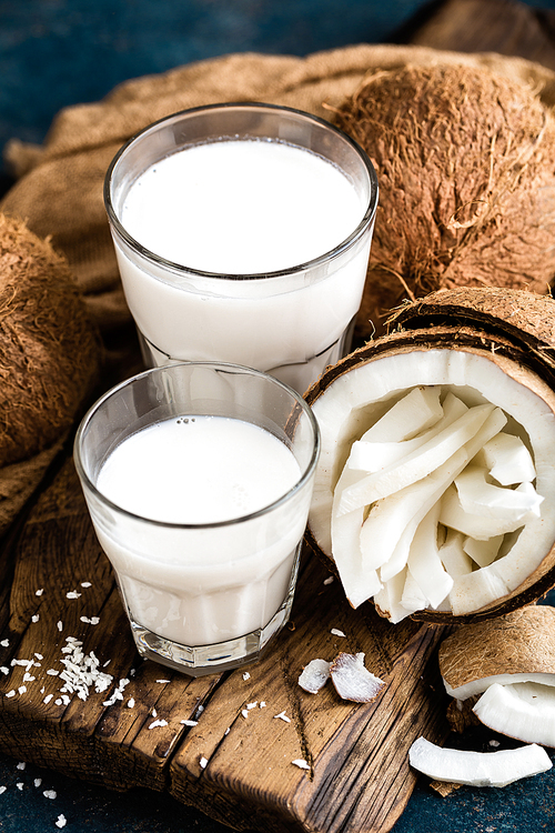 Fresh coconut milk in glass, vegan non dairy healthy drink