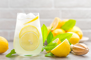 lemonade; lemon; drink; glass; juice; summer; fresh; background; fruit; cocktail; citrus; ice; water; cold; beverage; food; healthy; yellow; frozen; natural; white; sweet; refreshment; refreshing; straw; homemade; liquid; table; cool; vitamin; soda; closeup; sour; leaves; ingredient; citric; kitchen; delicious; tasty; lemonade drink; iced; icy; detox; infused; lemon juice; lemon drink; limeade; le