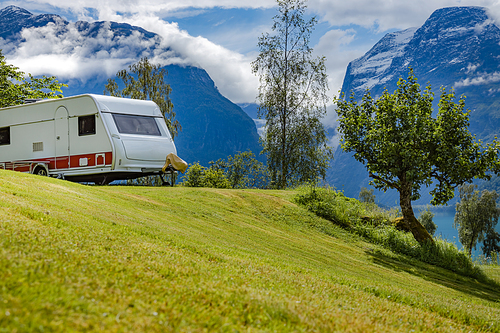 Family vacation travel RV, holiday trip in motorhome, Caravan car Vacation. Beautiful Nature Norway natural landscape.