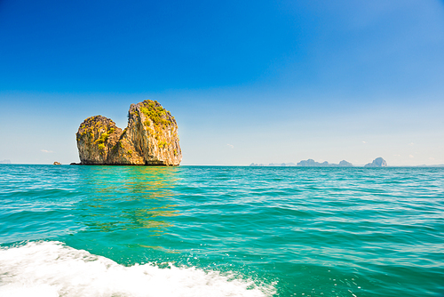 Landscape with rocky islands in tropical sea and blue sky