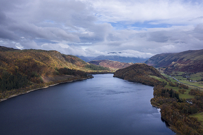 Beautiful aerial drone landscape image of glorious Autumn Fall sun over Thirlmere in Lake District