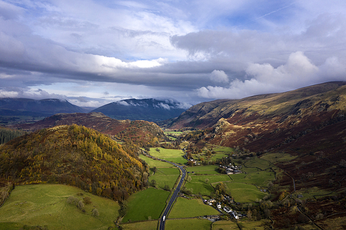 Beautiful aerial drone landscape image of glorious Autumn Fall sun over Thirlmere in Lake District