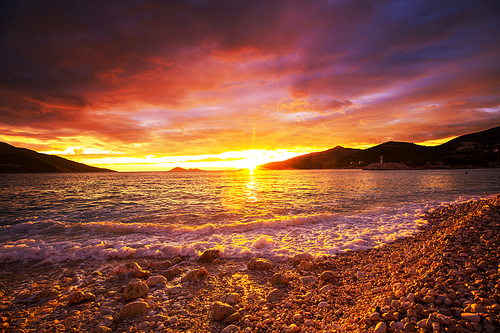 Scenic colorful sunset at the sea coast. Good for wallpaper or background image.