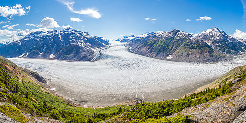 Beautiful scenery showing Salmon Glacier flowing down the mountains, Hyder, Alaska