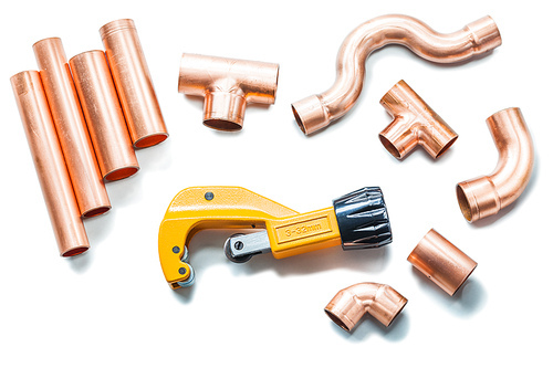 plubing tools copper pipes and fittings with pipe cutter isolated